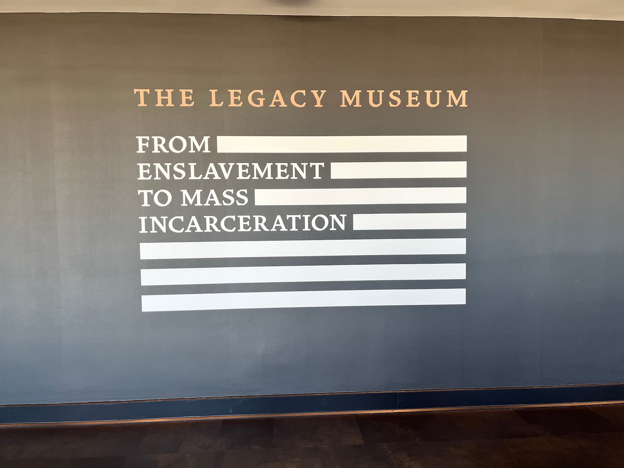 The Legacy Museum sign on a wall in Alabama